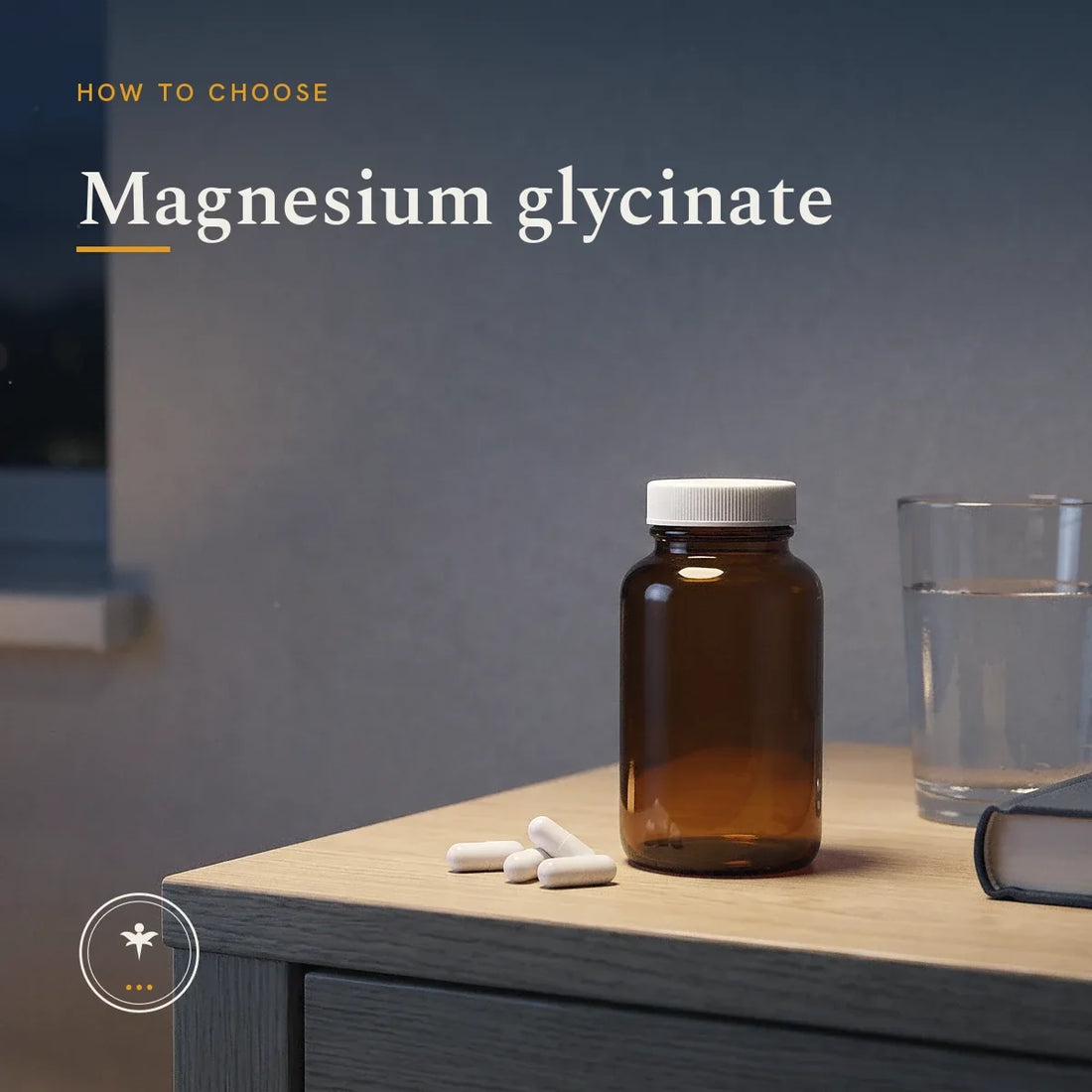 A plain unlabelled amber glass supplement bottle on a bedside table at night, with a few white capsules, a glass of water and a book beside it, lit by a single lamp.